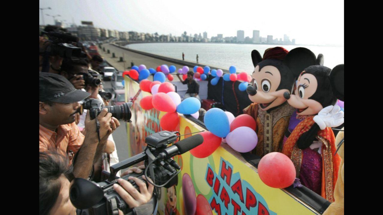 The character enjoys a massive following in India. Here, Mickey and Minnie Mouse, clad in traditional Indian attire, were pictured atop a bus in Mumbai on Mickey’s 80th birthday on November 18, 2008. Photo: AFP